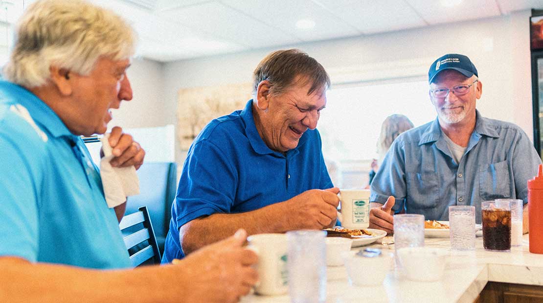 older gentlemen sitting at diner