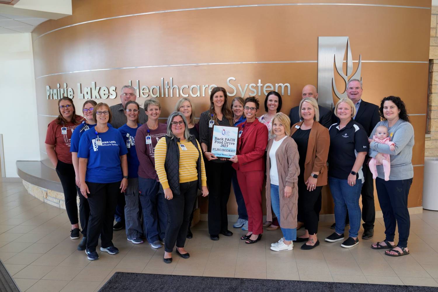 Watertown PACH Board Members Gather with PLHS Ambassadors &amp; Leadership to Receive the &quot;Largest Large Business Supporter&quot; Plaque