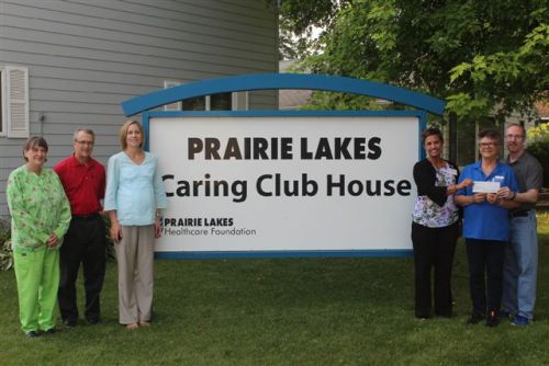 Shown presenting the check are members of the Hospital Hill Run Committee: Barb McBrien, Tom Beaudry, Kris Munger, and Dr. Dan Reiffenberger. Others pictured are Linda Page, Caring Club House Caretaker and Alison Gilbertson, Director, Prairie Lakes Healthcare Foundation.