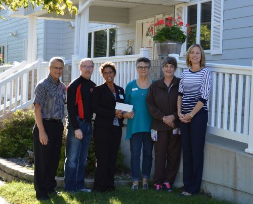 Presentation of the check at the Caring Club House.