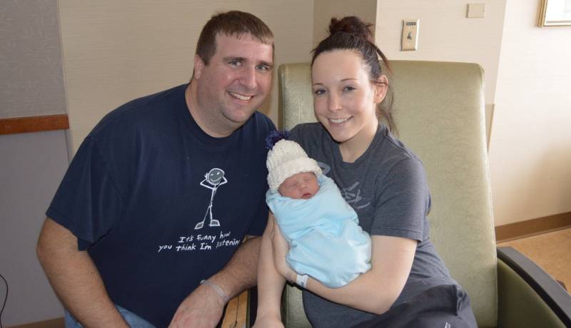 Photo of Ronan with his parents Mike and Jolynn.