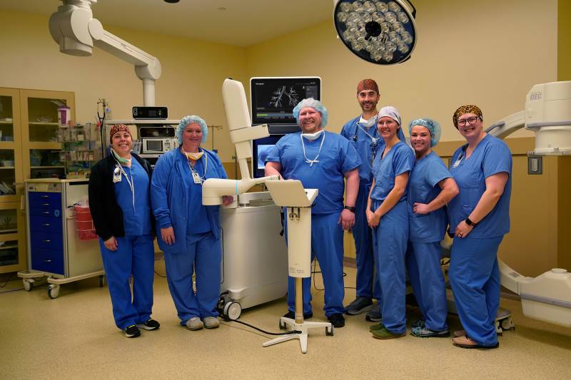 Dr. Senne with Surgical Team and Ion Robot in OR