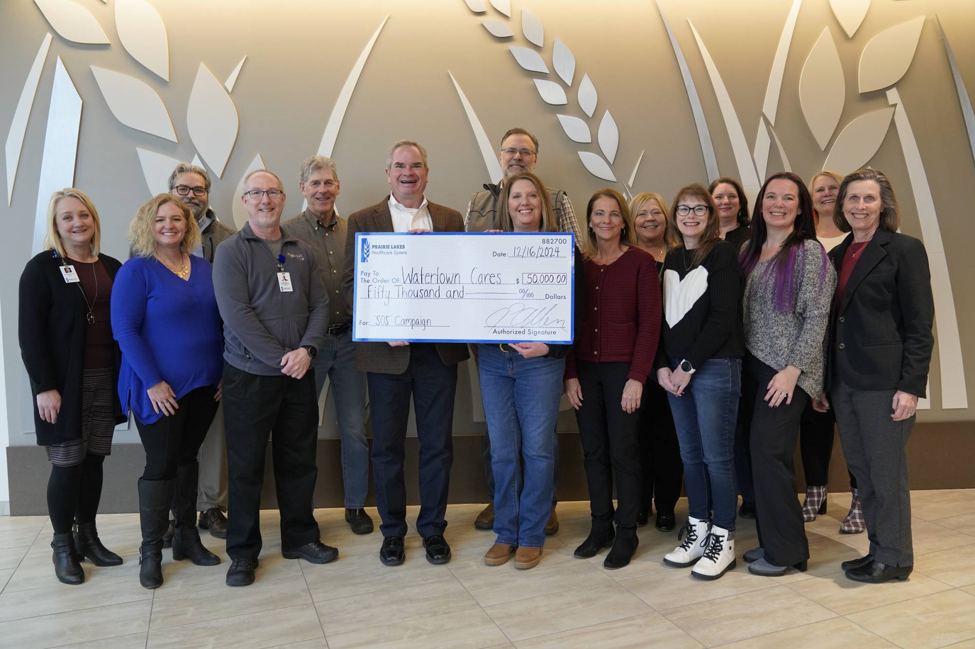 PLHS Administration presents a $50K check to Watertown Cares Board of Directors