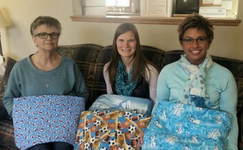 Linda Page, Caring Club House Caretaker, Nicole Goens, and Alison Gilbertson, Prairie Lakes Healthcare Foundation Director